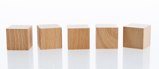 A row of building blocks on white background