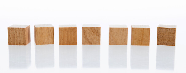 A row of building blocks on white background