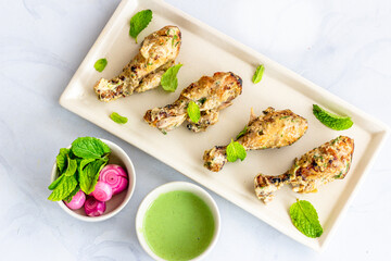 Traditional Indian Malai Chicken Tangdi Kebab with Chutney
