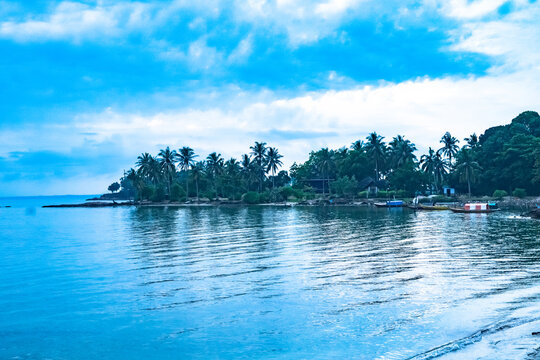 Mesmerizing scene of the magic blue water in the Islands in Batam, Indonesia against a cloudy sky
