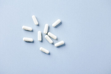 Selenium capsules. Concept for a healthy dietary supplementation. Bright paper background. Soft...