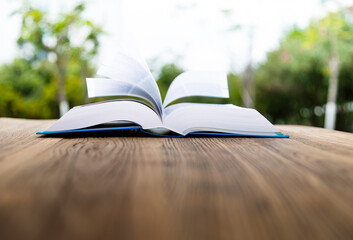 Open book on wooden table