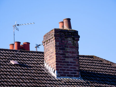 chimney and chimney pots on a tiled roofed house