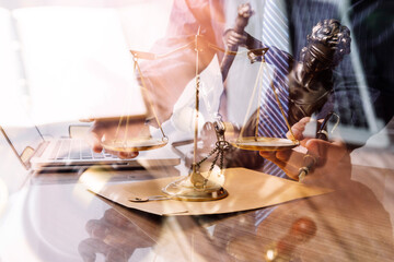 Justice and law concept. Gavel on sounding block in hand's Male judge at a courtroom, working with document law books, report the case on table in modern office.