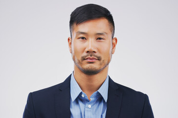 Hes a straight-faced businessman. Studio portrait of a handsome young businessman posing...