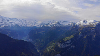 Fototapeta premium The wonderful mountains of the Swiss Alps - Switzerland from above by drone