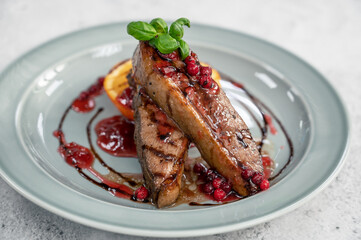 Tasty duck breast with orange and berries