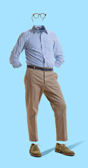 Creative portrait of invisible man wearing modern business style outfit and eyeglasses against blue background. Concept of fashion, creativity