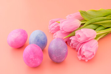 Beautiful pink tulips and Easter eggs, pink, blue, blue. Easter concept. Greeting card, trend color