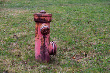 Closeup shot of an old fire hydrant in the garden