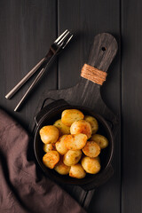 Fresh Cooked, new potatoes,with dill, on a wooden table, selective focus. close-up, toning, no people,