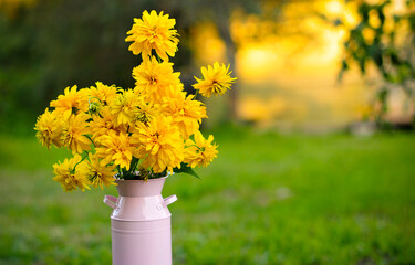 beautiful big bouquet of yellow flowers. pick flowers in the garden. Good morning on a sunny day in the garden. Greeting card with natural flower background. 