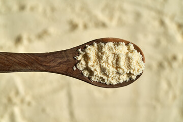 Closeup of whey protein powder on a spoon