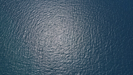 Blue sea surface from above, Aerial view of blue Ocean with waves from a high angle