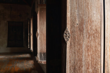 Antique carved wooden door of Chapel at Wat Choeng Tha ,Ayuthaya, Thailand. Handmade wooden window