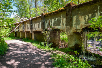 Fototapeta na wymiar Ruins of Nommeveski hydroelectric station. Spring landscape. Nõmmeveski, Estonia.