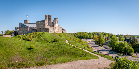 Fototapeta na wymiar Landscape with medieval Rakvere castle, Estonia. Ruins of a medieval knight's castle in sunny spring day.
