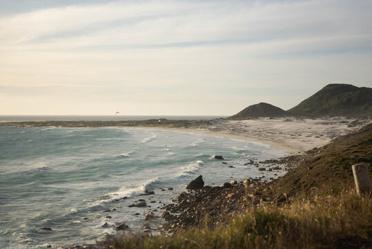 Beautiful view of the wavy South Atlantic Ocean hitting the sandy beach on the coast in Witsand - Powered by Adobe