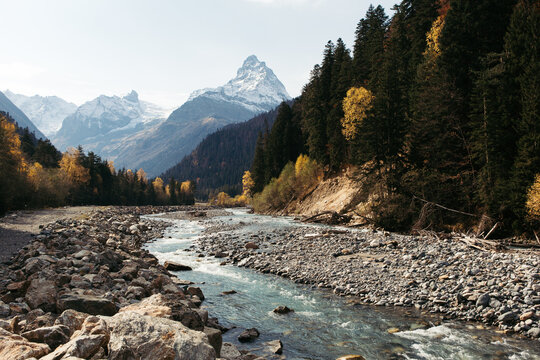 Landscape overlooking the river and mountains. Autumn. Valley of the Teberda river.