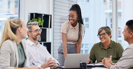 Were loving your ideas. Shot of a young businesswoman giving a presentation in her office.