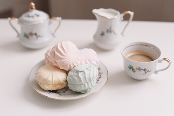 Good morning banner. Cup of coffee and homemade dessert zephyr. Top view. Food Photography with copy space. A cup of coffee and an airy marshmallow. Culinary background