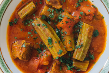 close up of Bamya, Bamia, okra beef middle eastern Persian Iraqi stew with lamb and tomato