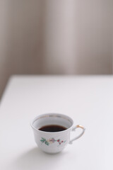 Good morning banner. Cup of coffee on a table. Minimal concept. Food Photography with copy space