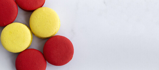 Homemade red macarons with strawberries