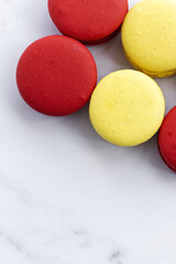 Homemade red macarons with strawberries