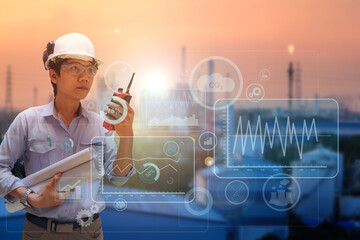 Asia engineer stand holding hand talking walkie-talkie on oil and gas refinery plant background,...
