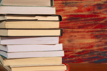 Close-up of background stack of old used books. Pile of vintage old books. Back to school