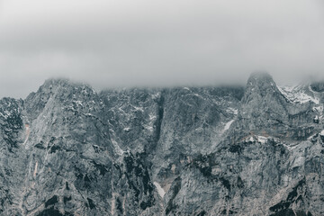 Layer of clouds covering mountain peaks in the Julian Alps in Slovenia