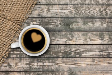 Espresso or black coffee in white cup on wooden desk