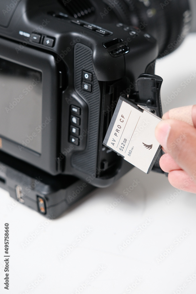 Sticker Vertical shot of a man putting a card into the camera