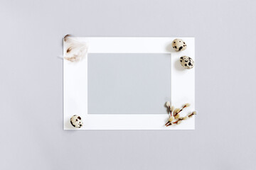 Template with Easter eggs and frame on the gray background