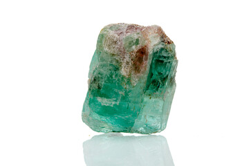 macro mineral stone emerald on a white background