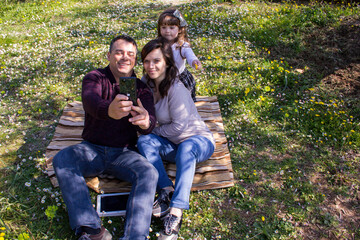 Fototapeta premium Cheerful family taking a selfie during a vacation in the countryside
