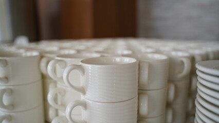 Many Empty White Tea Cups Blurred Background