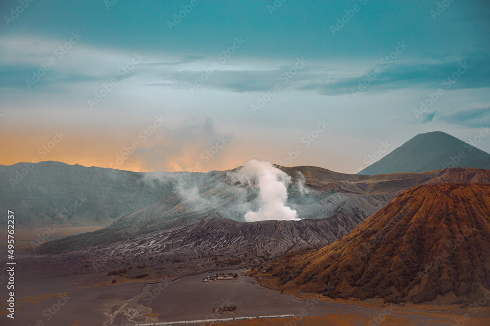 Wall mural Bromo Tengger Semeru National Park in Indonesia, with calderas, mountains, and a colorful sky