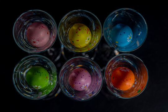 Easter color eggs in shots with black background