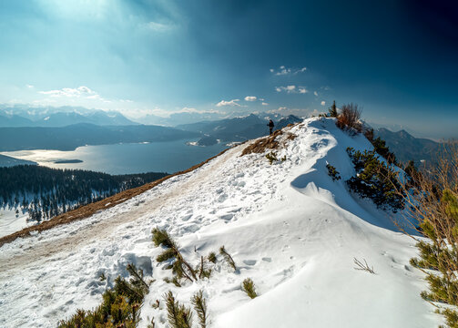 Jochberg snow landscape mountain peak with the Walchensee lake in panorama style