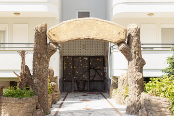 entrance to the hotel, at the entrance there is a wooden structure