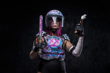 Outlaw woman protester with molotov cocktail against dark background