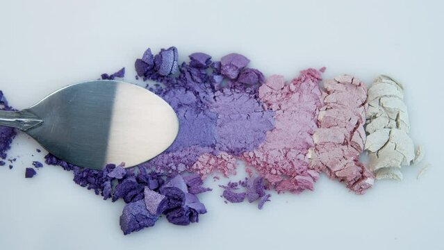 Texture of dry eye shadows of lilac, blue, pink and pearl shades. texture of eye shadows close-up. Advertising of decorative cosmetics.