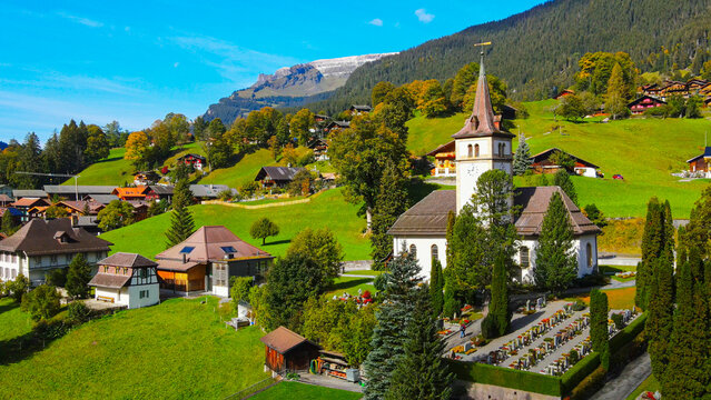 Famous city of Grindelwald in the Swiss Alps from above - drone footage