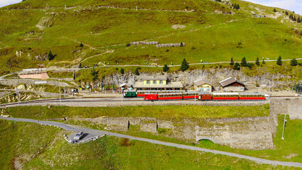 Famous cog railway on the mountain Schynige Platte in Switzerland - a popular tourist attraction