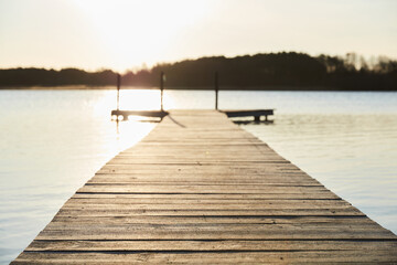 pier on lake at sunrise 