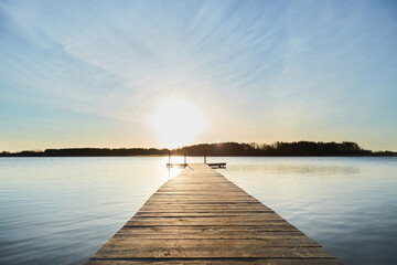 Obraz na płótnie Canvas pier on lake at sunrise