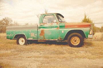 Beautiful shot of an old rural pickup during the day - obrazy, fototapety, plakaty