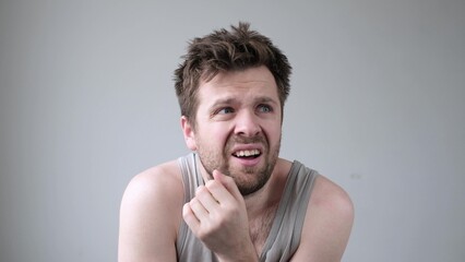 Caucasian nervous man looking around having hallucinations.